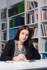 Young female student in library