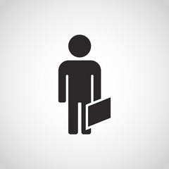 Businessman standing with a suitcase.