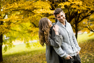 Young couple in the autumn park