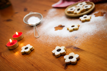 christmas cookies with fruit jelly on wooden table