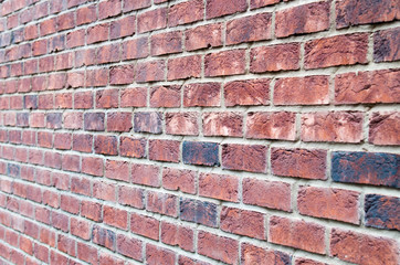 Fragment of brown brick wall