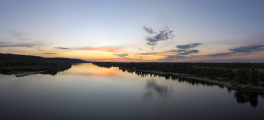 Fototapeta na wymiar Sunset on the river Pripyat.Mozyr, Belarus.