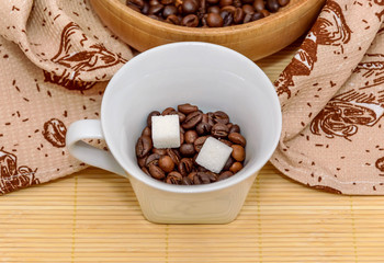 coffee beans and sugar in white cup