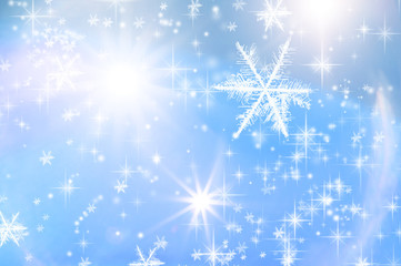 Fototapeta na wymiar stimmungsvoller Sternenglanz und Eiskristalle auf blauem Hintergrund
