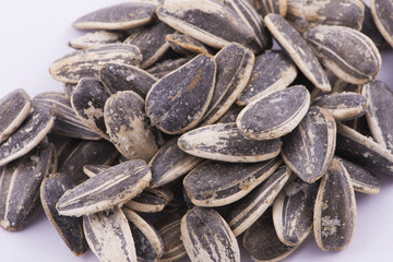 Sunflower seeds on white background.