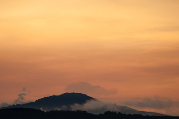 Hills with fog at sunrise