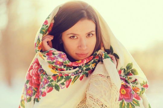 beautiful model in a traditional Russian scarf winter