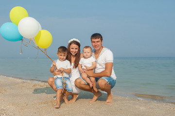 Fototapeta na wymiar Family having fun on the beach