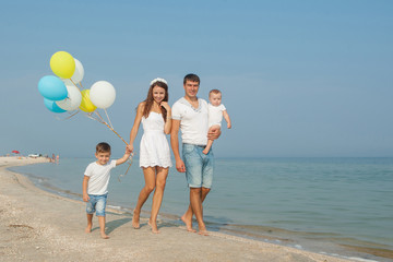 Family having fun on the beach