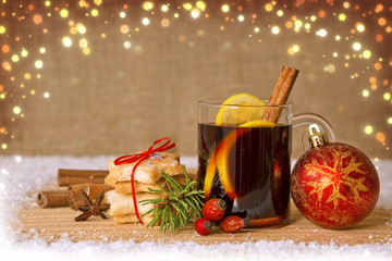 Mulled wine and red Christmas ball.