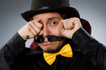 Funny magician man wearing tophat