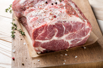 Photo of raw meat. Pork neck with herbs