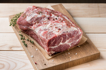 Photo of raw meat. Pork neck with herbs