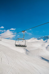 Ski lifts durings bright winter day