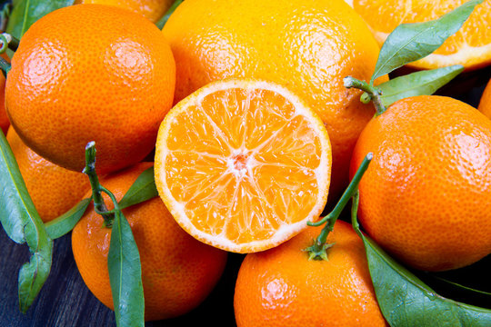 orange fruit and fresh tangerines oranges on wood