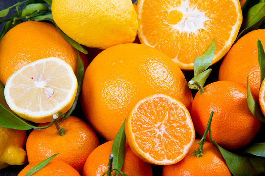 orange fruit , fresh tangerines oranges and citrus on wood