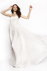 Fototapeta na wymiar Brunette in white dress posing 