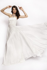 Fototapeta na wymiar Brunette in white dress posing 