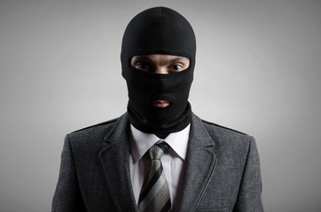 robber in a gray tuxedo