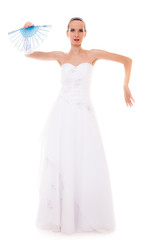 Full length bride in wedding gown holds fan isolated