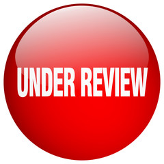 under review red round gel isolated push button