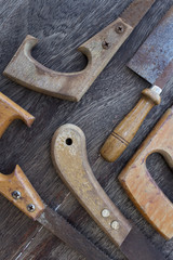 saws / old handsaws details on wooden background