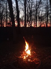 dramatic December sunset with campfire