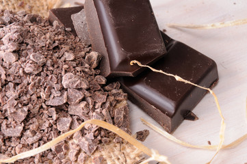 Portions of artisan chocolate and chunks close up top view