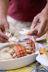 Chef pulling delicious cooked crab white meat out of claws  