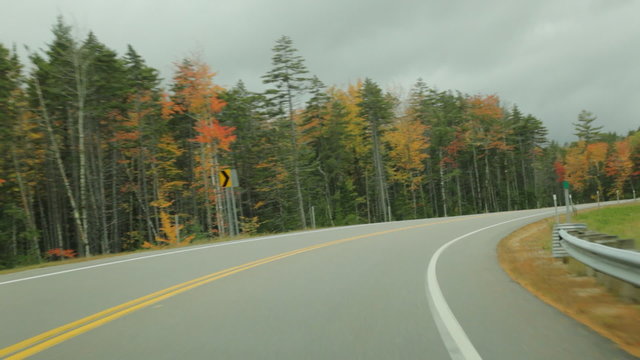 Driving POV on the Kancamagus (Kanc) Highway during Autumn in the White Mountains of New Hampshire.