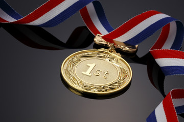 Gold medal on black background