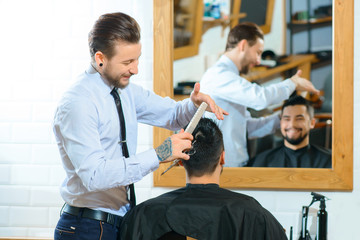 Fototapeta premium Professional barber making haircut 