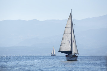 Fototapeta premium Sailing in the wind through the waves. Luxury yachts.