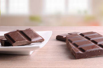 Portions of chocolate in white dish in living room
