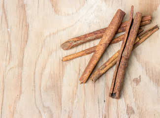 cinnamon sticks on  wooden table