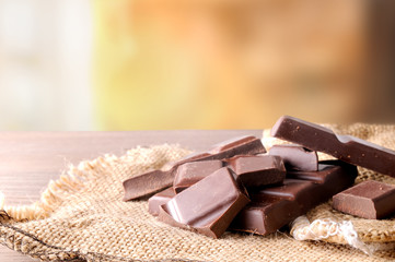 Heap of artisan portions chocolate on burlap front view