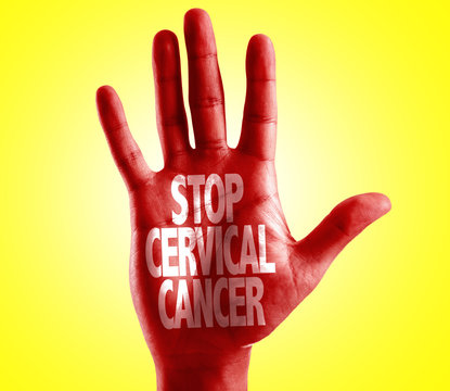 Stop Cervical Cancer written on hand with yellow background