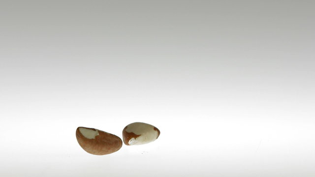 Super Slow Motion Brezil Nuts Falling on White Surface