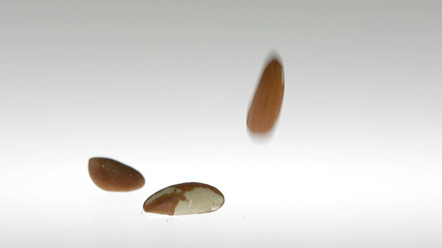 Super Slow Motion Brezil Nuts Falling on White Surface