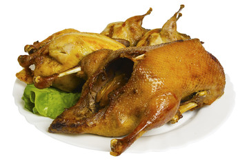 Wild birds baked on the plate, isolated