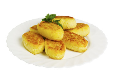 potato cakes with mushrooms on the plate, isolated