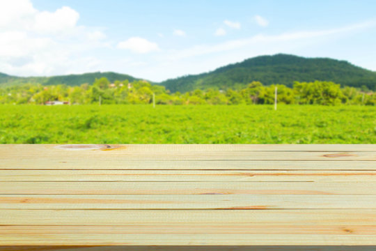 Empty top wooden table and view of mountain. Can use for product display