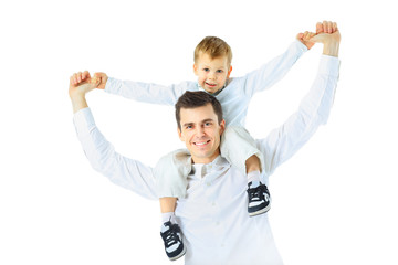 Dad holding his son on his shoulders, his arms outstretched