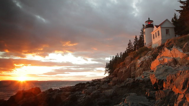 Locked down view of Bass Harbor, Maine lighthouse at sunset.
