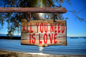 All you need is love motivational phrase sign