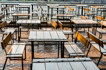 River view of a coffee terrace with tables and chairs in Thailand