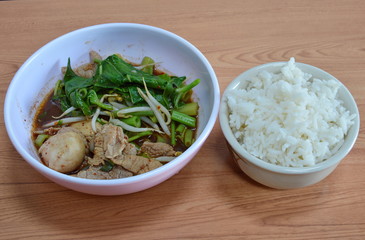 boiled slice pork in brown soup eat with rice