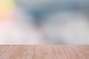 Fototapeta premium Wood table top on color abstract blurred background. ready for product display