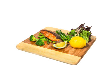 Grilled Salmon with Fresh Salad Leaf on white background