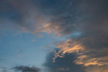 Fototapeta na wymiar twilight sunset sky with cloudy and sunlight through clouds